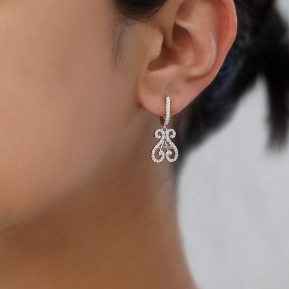Silver rhodium-plated orus logo earrings 2